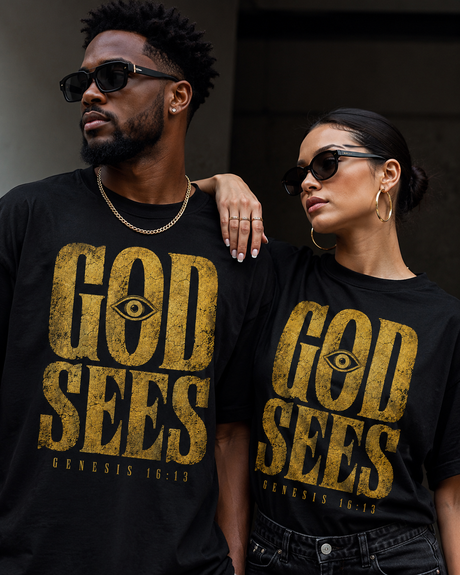 Signature Pieces — couple wearing black and gold God Sees faith streetwear tees by God Sees You Wear